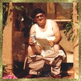 Tony sitting on a bush dunny (on a float in a parade) c 1996